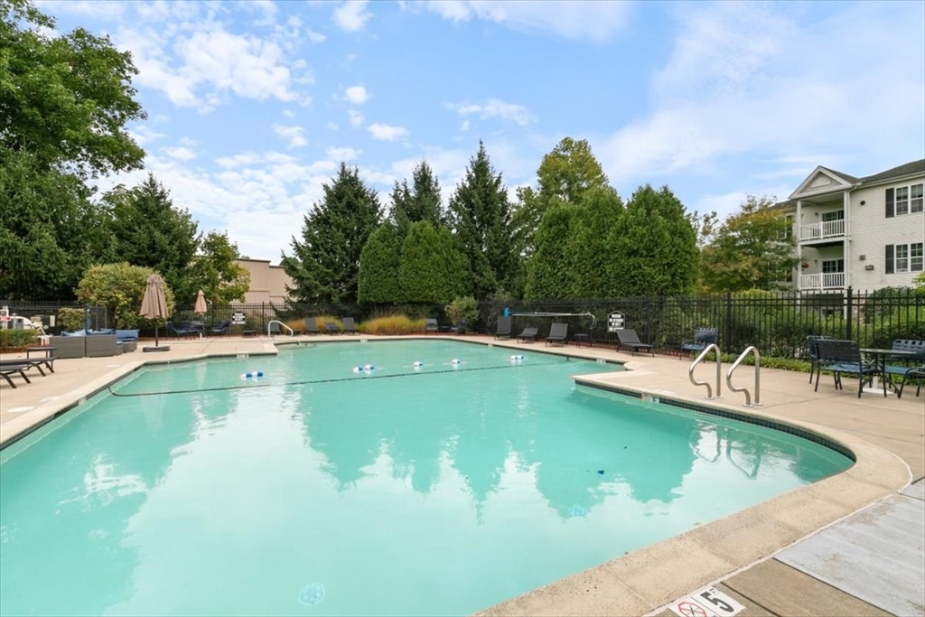 21 Hampshire Road, Unit 313 Methuen, MA 01844 - Photo 24 of 35 a view of a swimming pool and a chairs