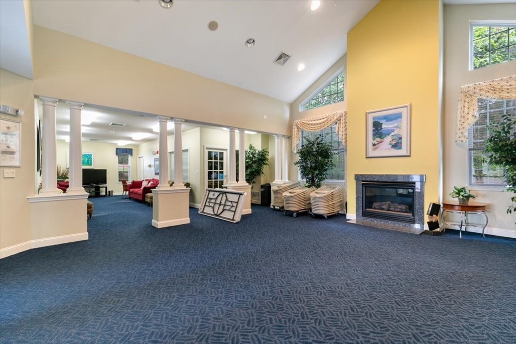 21 Hampshire Road, Unit 313 Methuen, MA 01844 - Photo 27 of 35 a living room with furniture and a fireplace