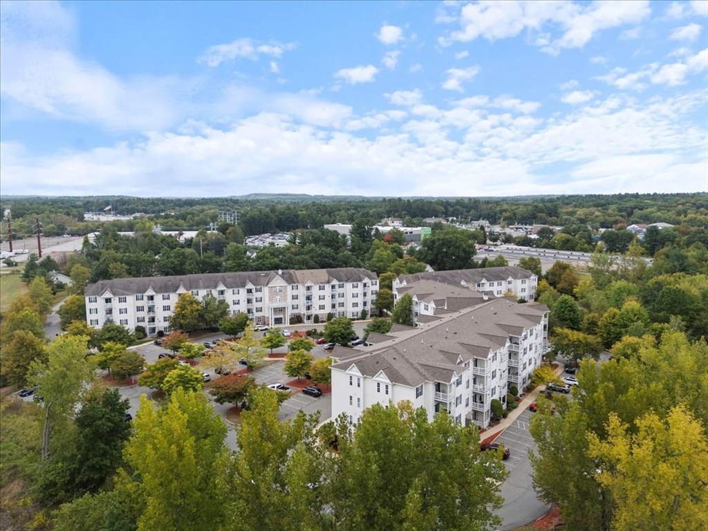 21 Hampshire Road, Unit 313 Methuen, MA 01844 - Photo 29 of 35 a view of a lake with houses in back