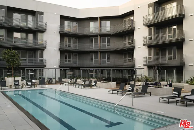 a view of a house with pool table and chairs