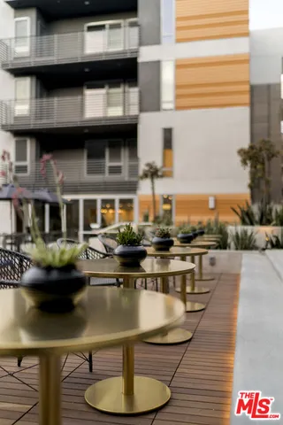 a outdoor space with patio fireplace and a potted plant