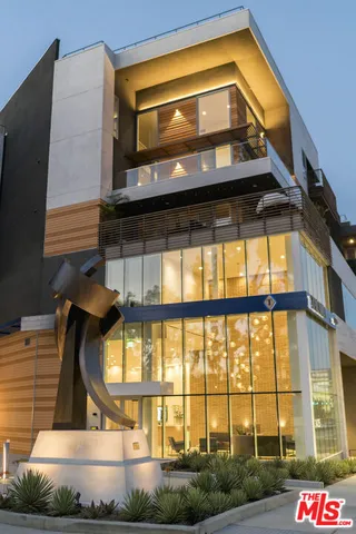 a view of a building with a street