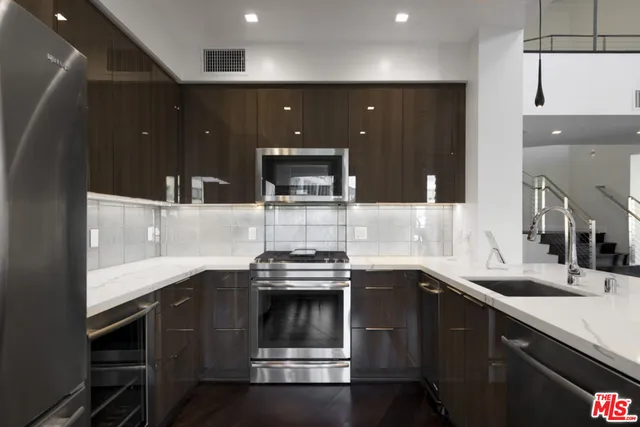 a kitchen with a sink and cabinets