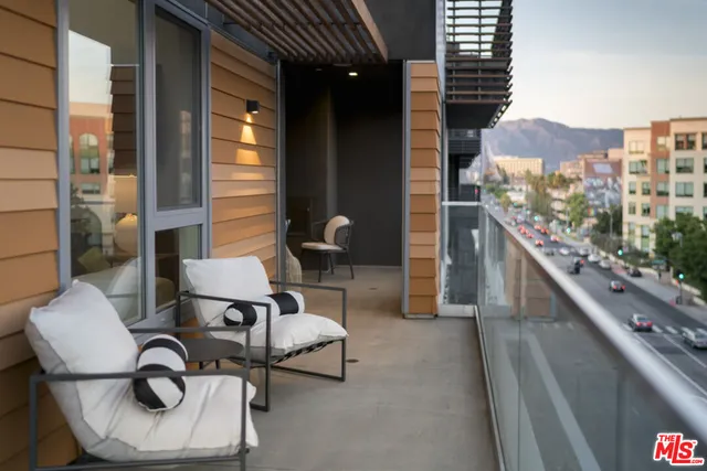 a balcony view with chairs and outdoor view