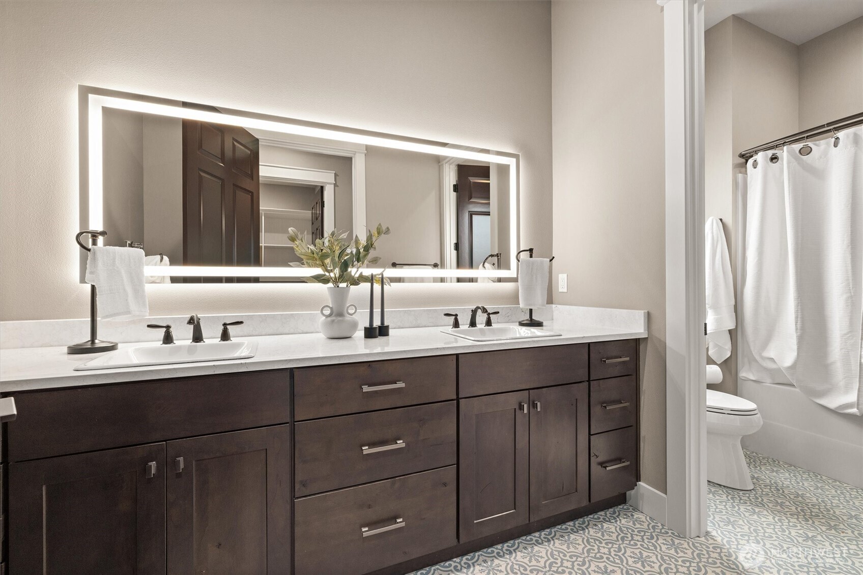 151 East Windy Ridge Lane Belfair, WA 98528 - Photo 27 of 40 a bathroom with a double vanity sink toilet and a mirror