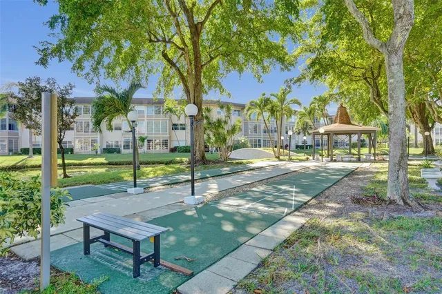 a view of a park with plants and trees