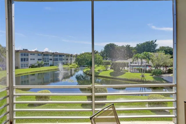 a view of house with a swimming pool