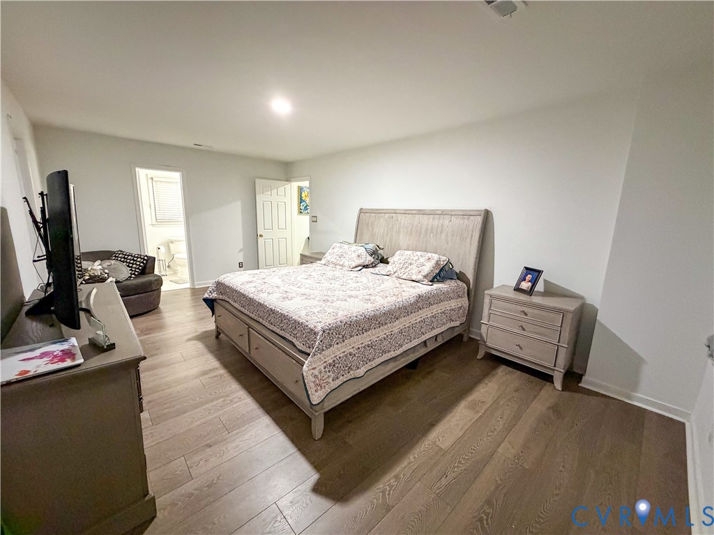 13727 Nashua Terrace Midlothian, VA 23112 - Photo 18 of 33 a bedroom with a bed and a flat screen tv