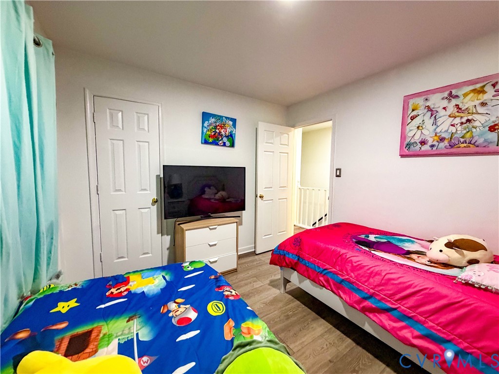 13727 Nashua Terrace Midlothian, VA 23112 - Photo 24 of 33 a bedroom with a bed and a flat screen tv