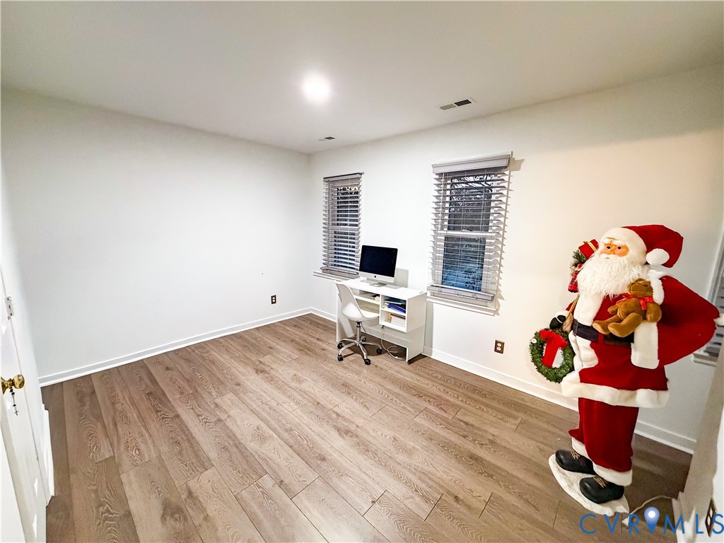 13727 Nashua Terrace Midlothian, VA 23112 - Photo 25 of 33 a room with wooden floor and gym equipment