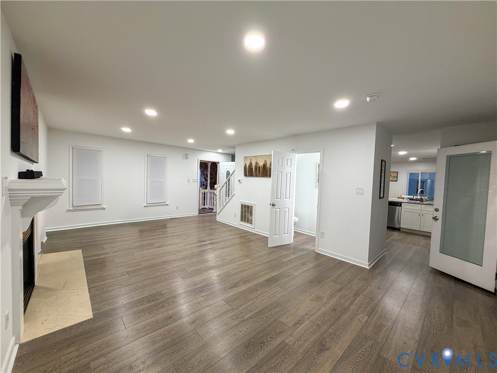 13727 Nashua Terrace Midlothian, VA 23112 - Photo 6 of 33 an empty room with wooden floor and windows