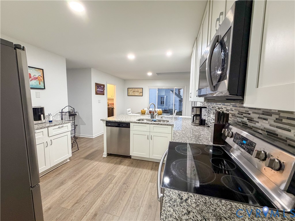 13727 Nashua Terrace Midlothian, VA 23112 - Photo 9 of 33 a kitchen with a sink stove and refrigerator