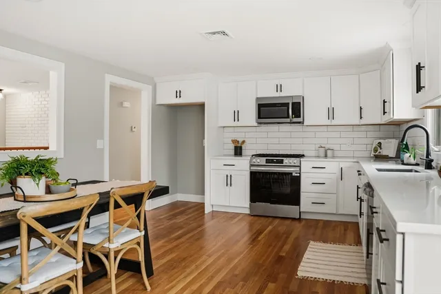 a kitchen with a stove and a refrigerator