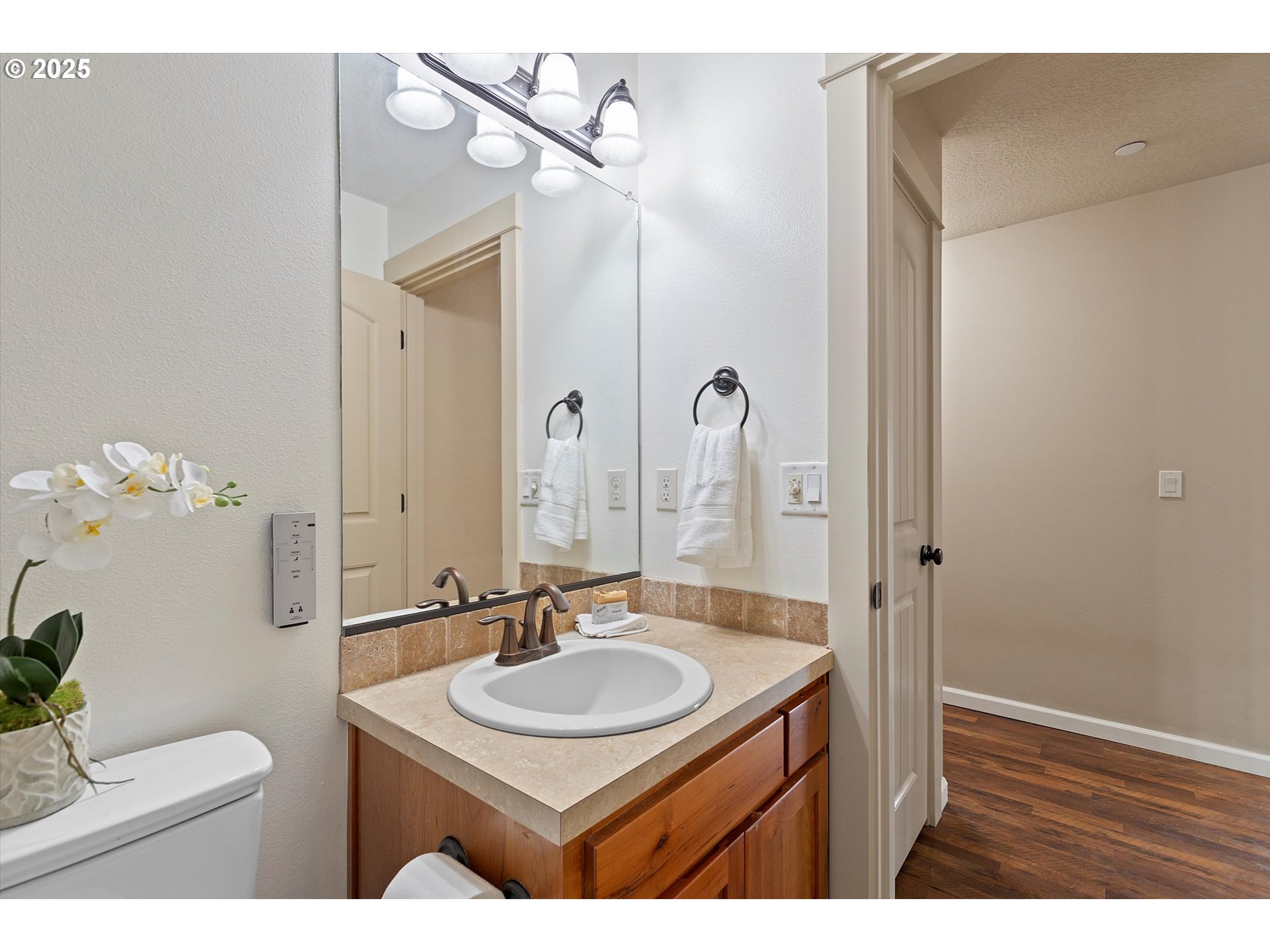 723 North 7th Street Carlton, OR 97111 - Photo 12 of 32 a bathroom with a sink and a mirror