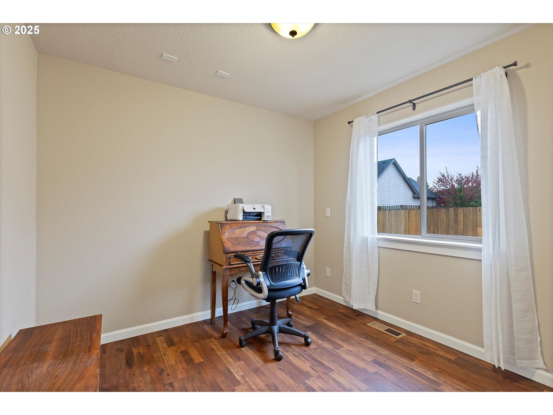 723 North 7th Street Carlton, OR 97111 - Photo 16 of 32 a workspace with furniture and wooden floor