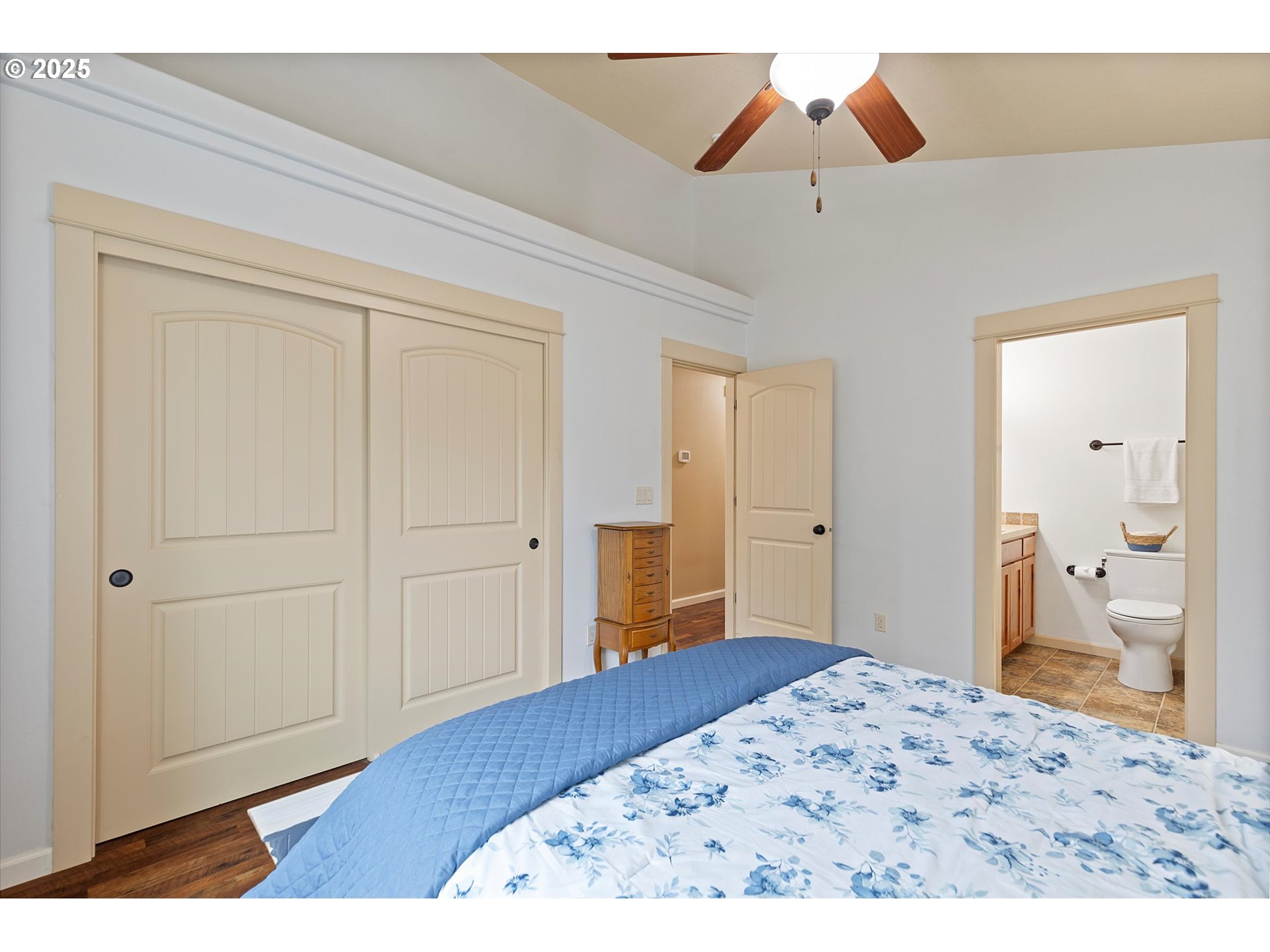 723 North 7th Street Carlton, OR 97111 - Photo 19 of 32 a bedroom with a bed and a chandelier