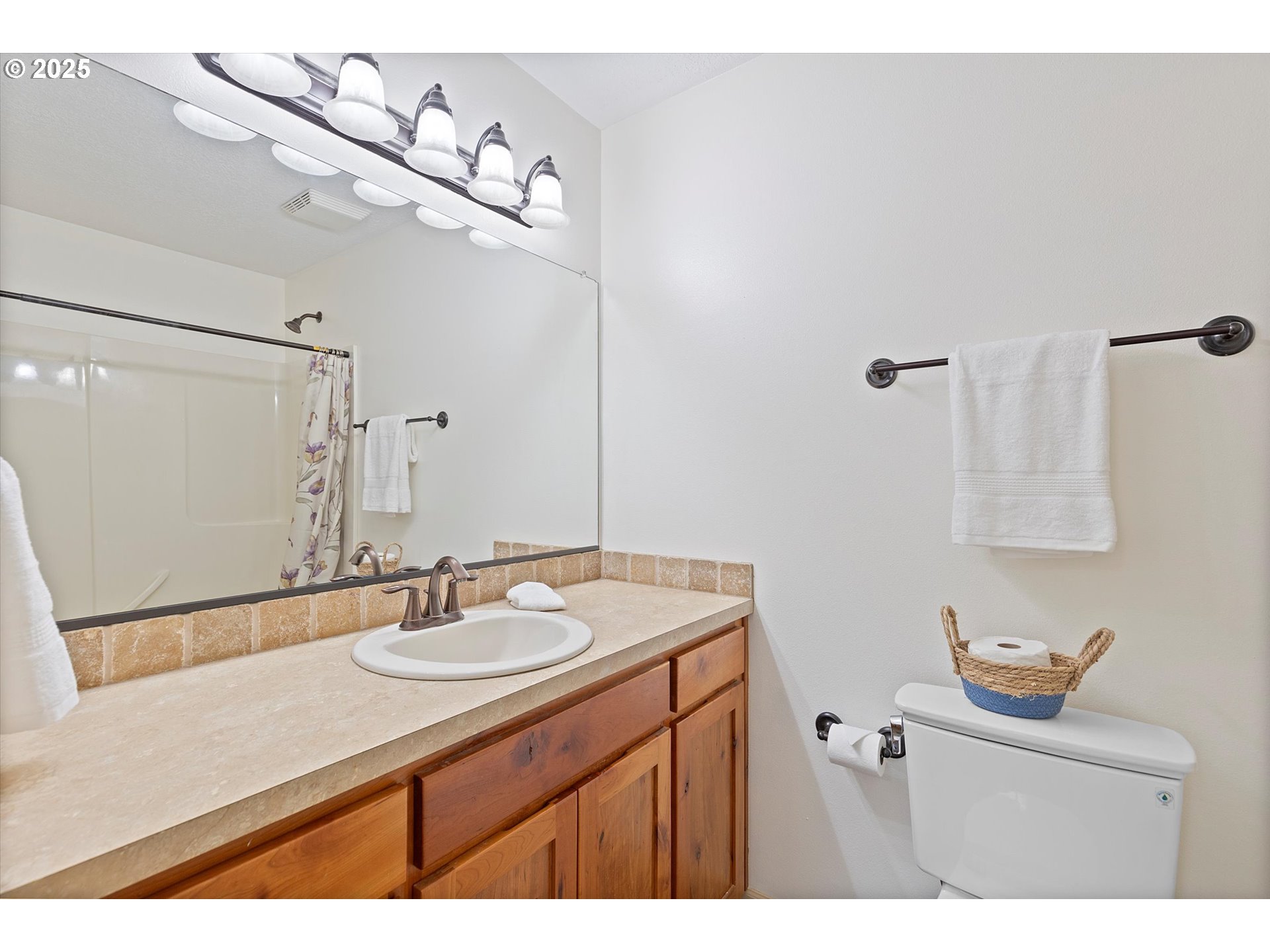 723 North 7th Street Carlton, OR 97111 - Photo 20 of 32 a bathroom with a sink and a mirror