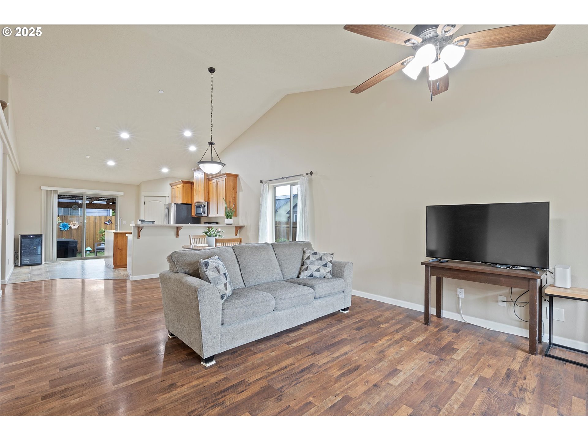 723 North 7th Street Carlton, OR 97111 - Photo 2 of 32 a living room with furniture and a flat screen tv
