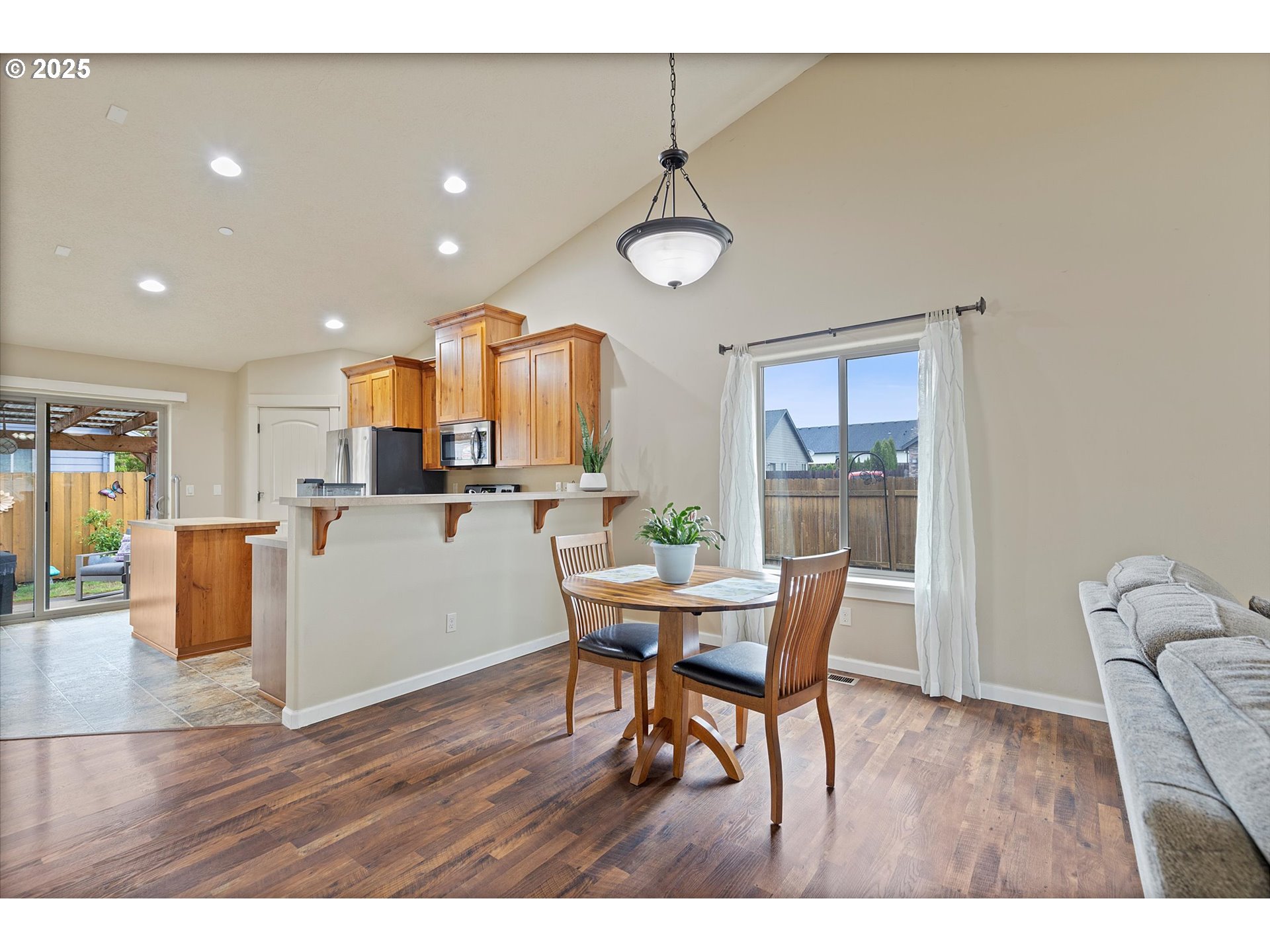 723 North 7th Street Carlton, OR 97111 - Photo 6 of 32 a living room with furniture and kitchen view