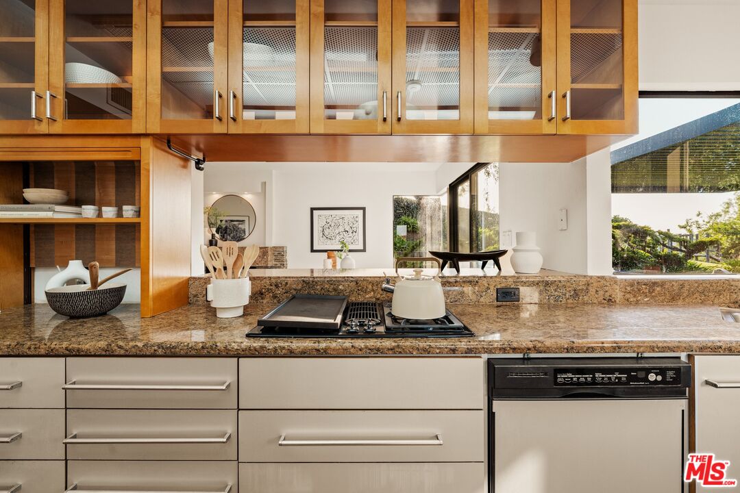 4303 San Rafael Avenue Los Angeles, CA 90042 - Photo 19 of 74 a kitchen with a stove and cabinets