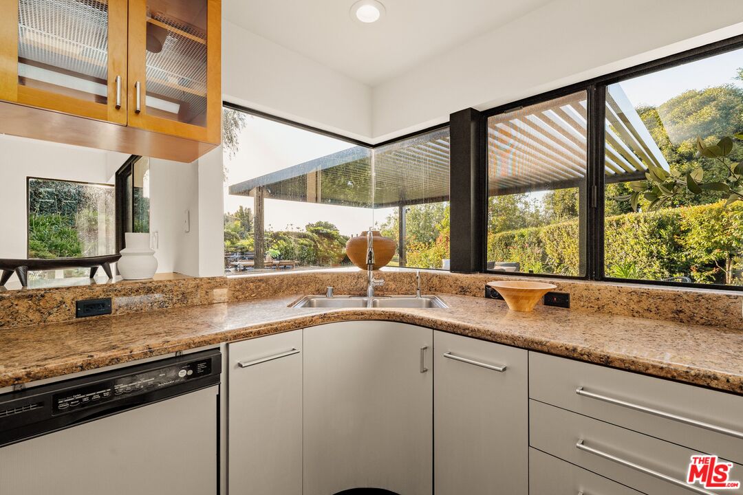4303 San Rafael Avenue Los Angeles, CA 90042 - Photo 20 of 74 a view of a kitchen with granite countertop sink and window