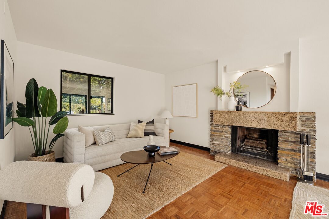 4303 San Rafael Avenue Los Angeles, CA 90042 - Photo 23 of 74 a living room with furniture and a fireplace