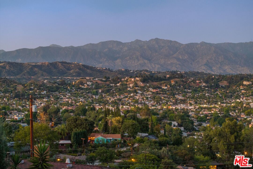 4303 San Rafael Avenue Los Angeles, CA 90042 - Photo 4 of 74 an aerial view of residential house and mountains