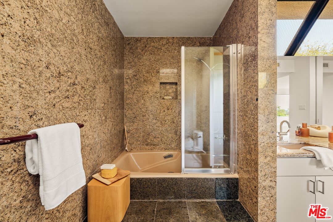 4303 San Rafael Avenue Los Angeles, CA 90042 - Photo 45 of 74 a bathroom with a bathtub and shower