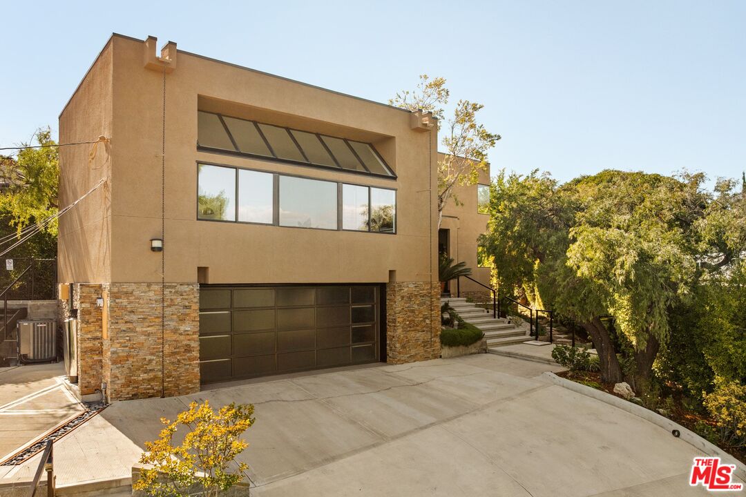 4303 San Rafael Avenue Los Angeles, CA 90042 - Photo 53 of 74 a front view of a house with a yard