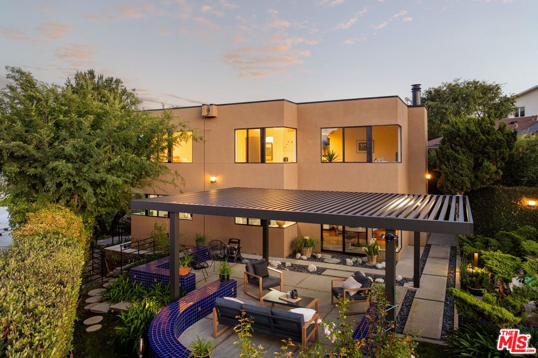 4303 San Rafael Avenue Los Angeles, CA 90042 - Photo 62 of 74 a view of a patio with table and chairs and potted plants