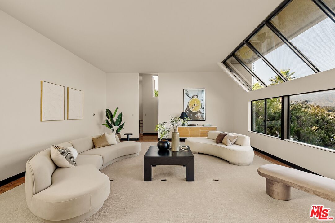4303 San Rafael Avenue Los Angeles, CA 90042 - Photo 7 of 74 a living room with furniture and a large window