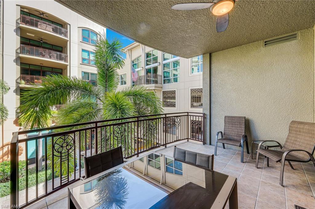 9123 Strada Place, Unit 7201 Naples, FL 34108 - Photo 20 of 50 a balcony with furniture and a potted plant
