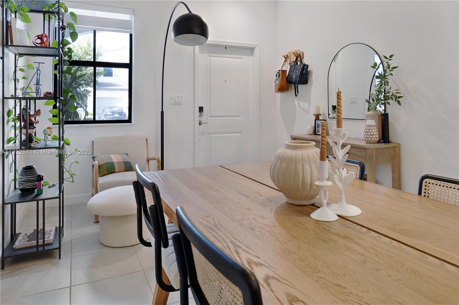 23471 Southwest 129th Path Homestead, FL 33032 - Photo 15 of 52 a dining room with furniture and window
