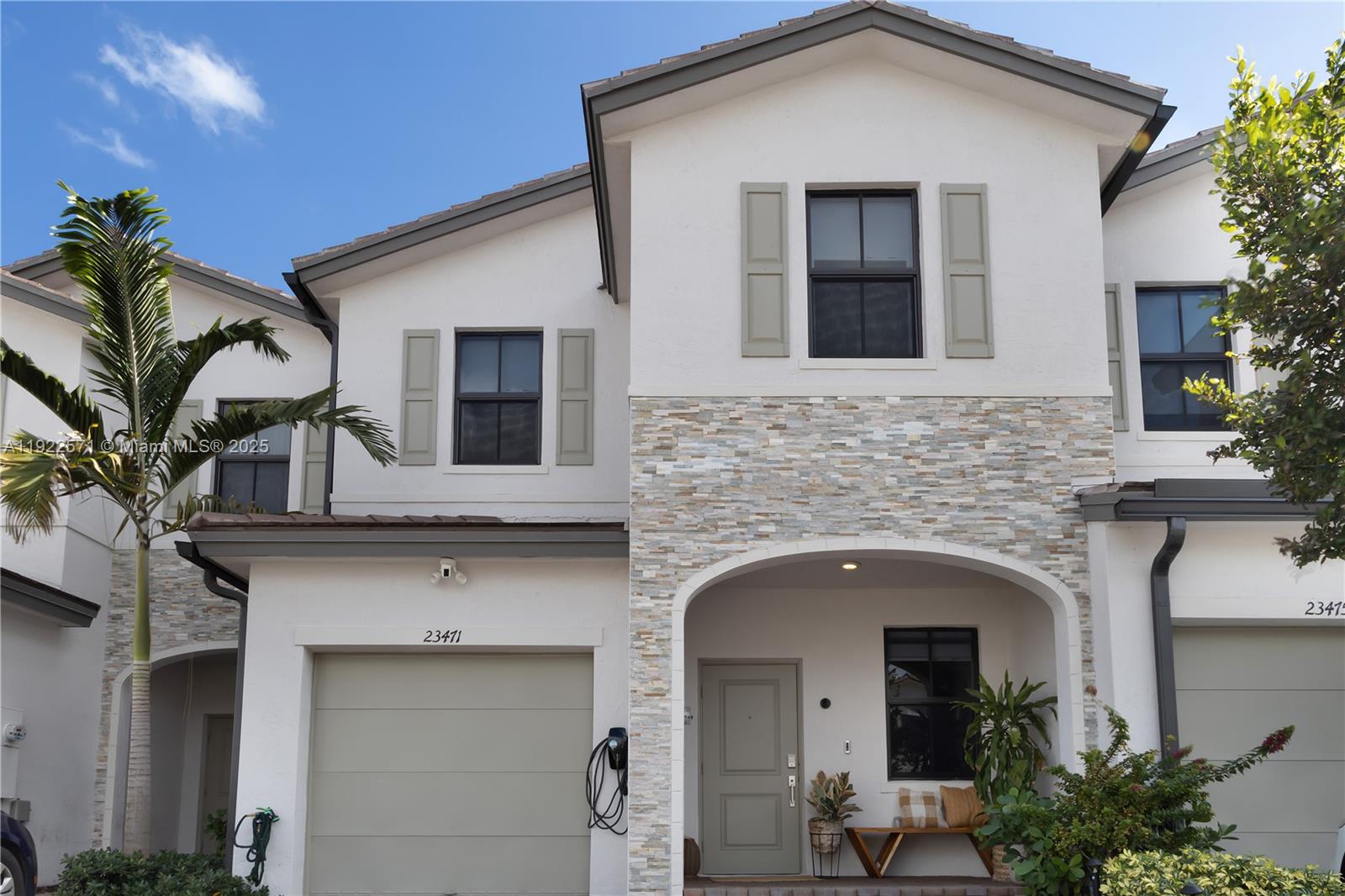 23471 Southwest 129th Path Homestead, FL 33032 - Photo 2 of 52 a front view of a house with plants