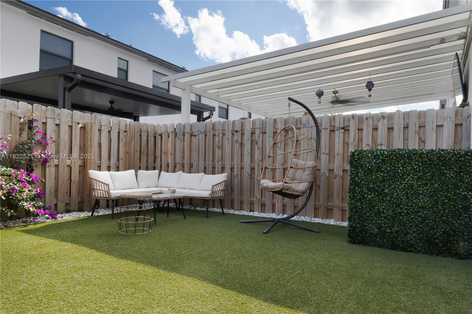 23471 Southwest 129th Path Homestead, FL 33032 - Photo 27 of 52 a backyard of a house with barbeque oven table and chairs