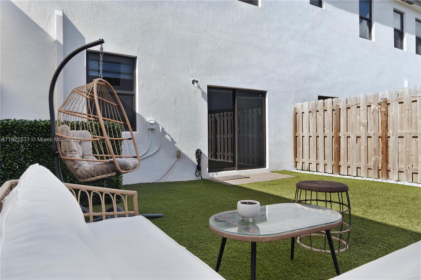 23471 Southwest 129th Path Homestead, FL 33032 - Photo 29 of 52 a balcony with table and chairs