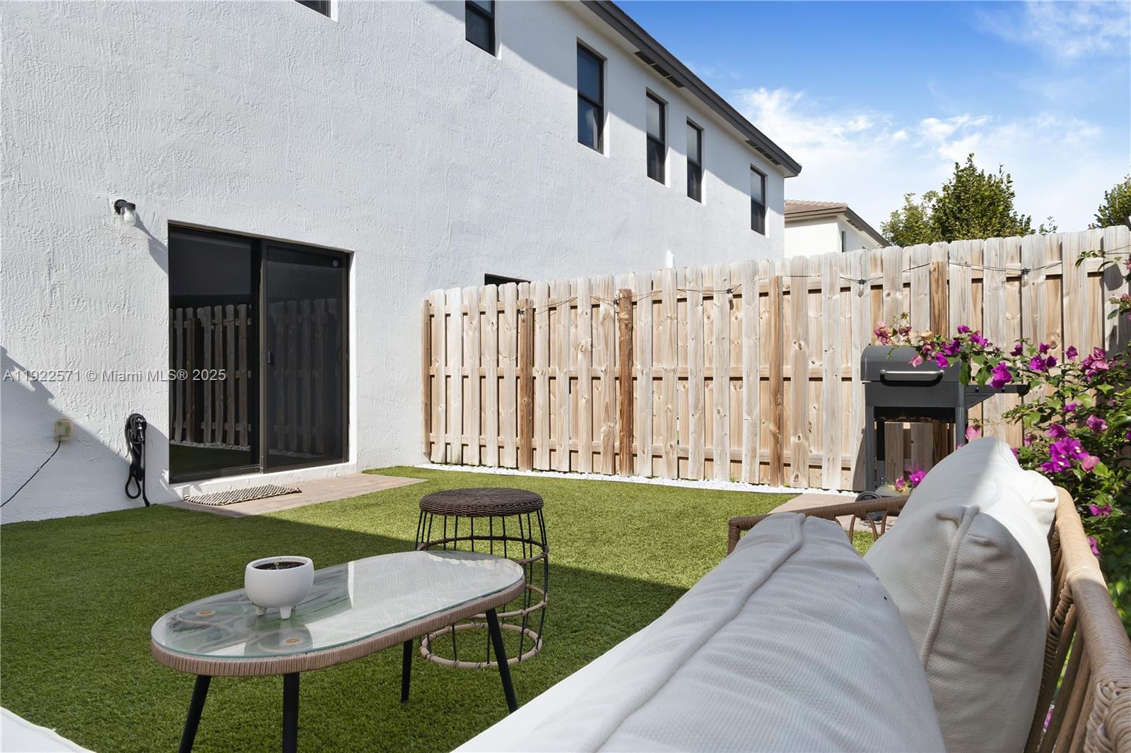 23471 Southwest 129th Path Homestead, FL 33032 - Photo 3 of 52 a backyard of a house with table and chairs