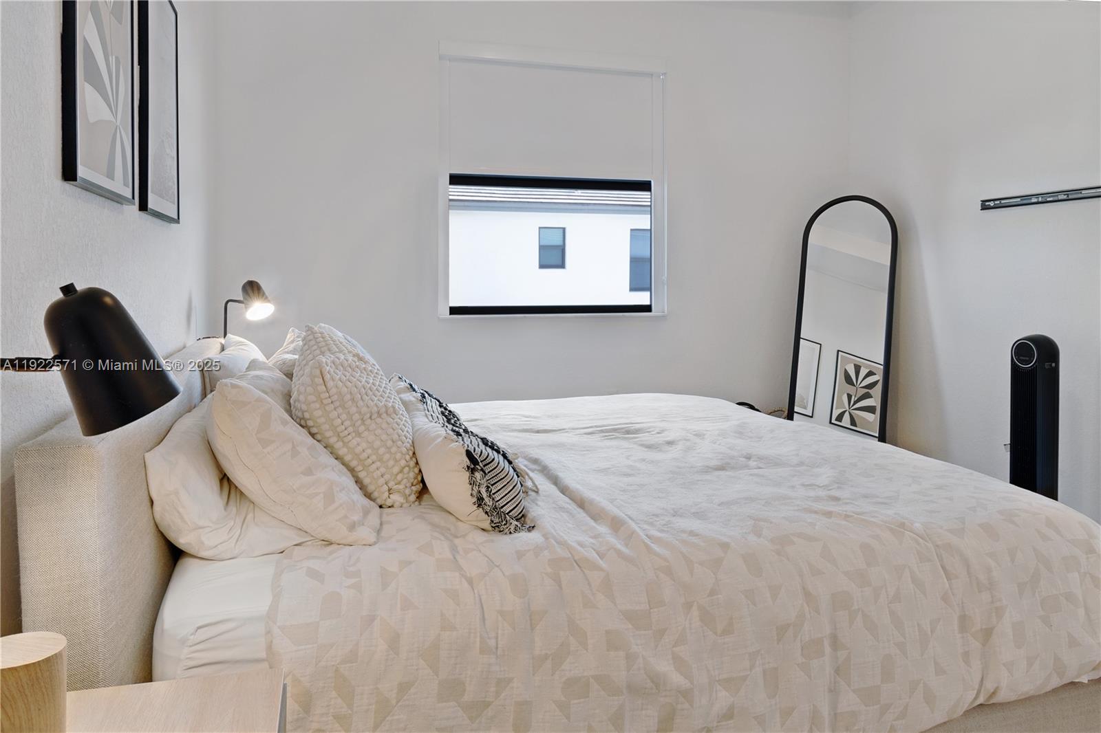 23471 Southwest 129th Path Homestead, FL 33032 - Photo 34 of 52 a bedroom with a bed and a painting on the wall