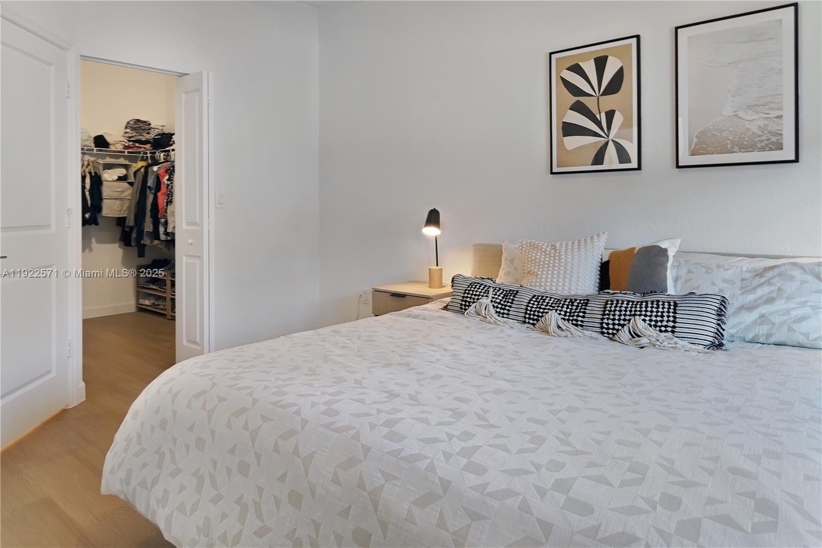 23471 Southwest 129th Path Homestead, FL 33032 - Photo 35 of 52 a bedroom with a bed and a view of kitchen