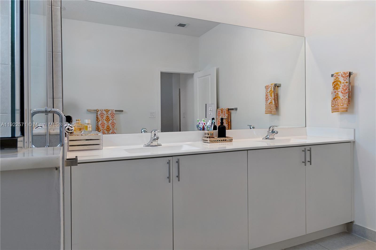 23471 Southwest 129th Path Homestead, FL 33032 - Photo 38 of 52 a bathroom with a sink and a mirror