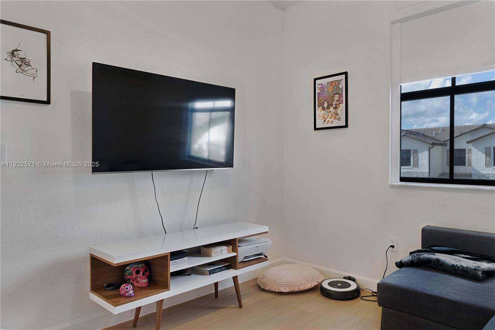 23471 Southwest 129th Path Homestead, FL 33032 - Photo 42 of 52 a living room with furniture and a flat screen tv