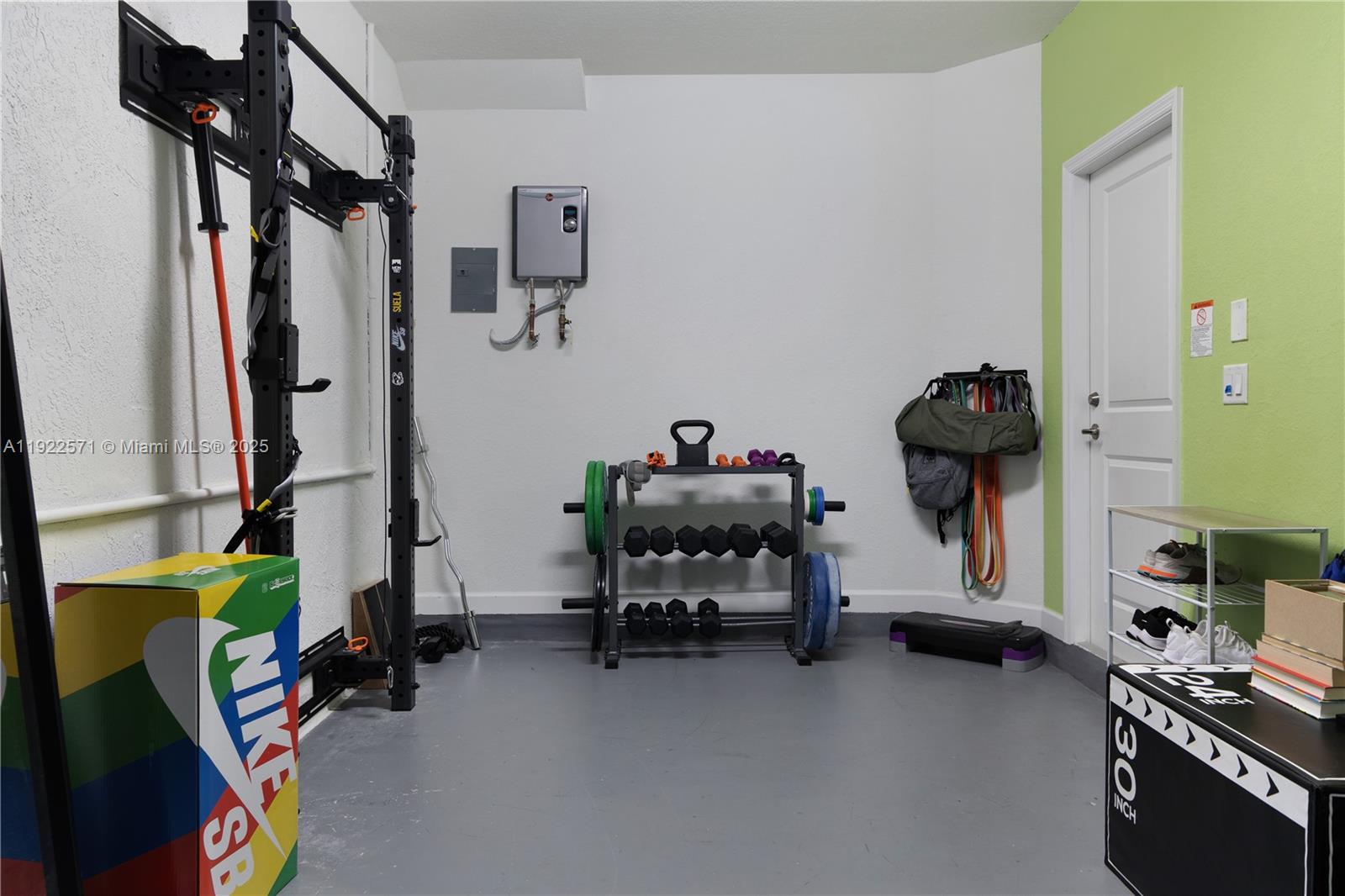 23471 Southwest 129th Path Homestead, FL 33032 - Photo 51 of 52 a view of a room with gym equipment