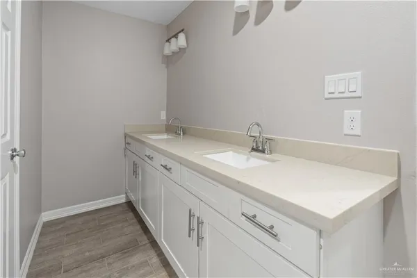 a bathroom with a sink and a mirror
