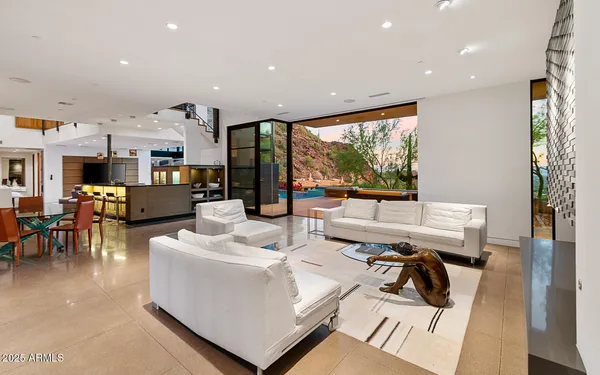 a living room with furniture and a large window