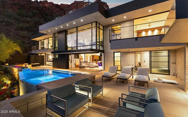 a view of a patio with swimming pool table and chairs