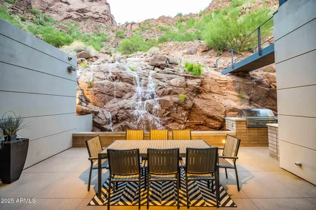 a view of a chairs and table in patio