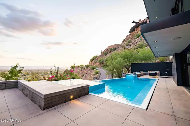 a view of a backyard with sitting area