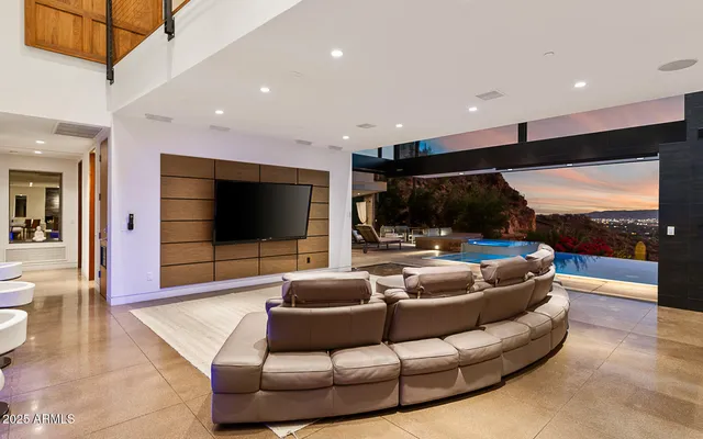 a living room with couch and a flat screen tv
