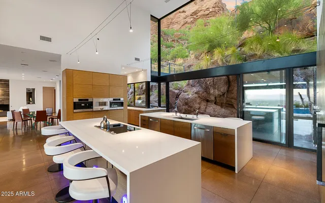 a kitchen with a stove a sink and a refrigerator