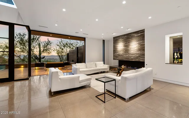 a living room with fireplace furniture and a flat screen tv